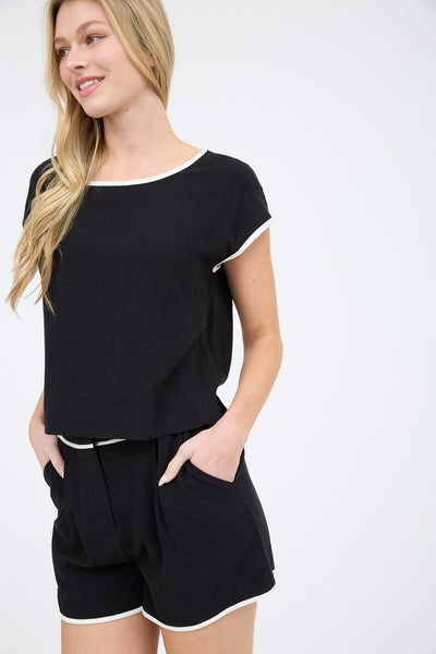 Blusa beige orilla negra