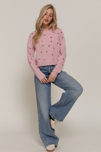 Suéter rosa corazón