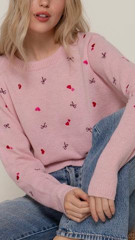 Suéter rosa corazón