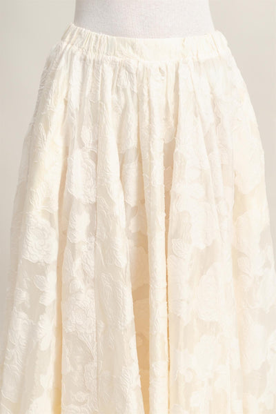 Falda beige a media pierna