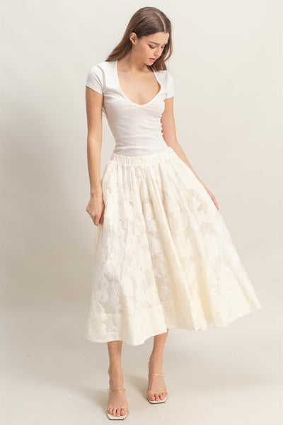 Falda beige a media pierna