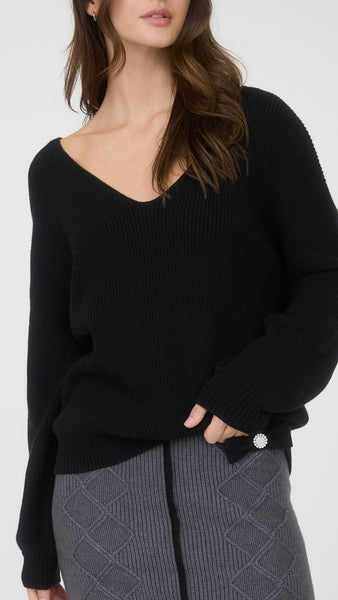 Suéter negro moño